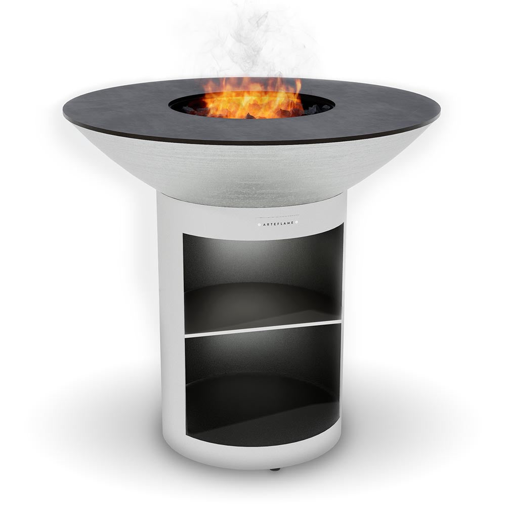 Arteflame 40 stainless grill on the stainless storage base with a fire in the center
