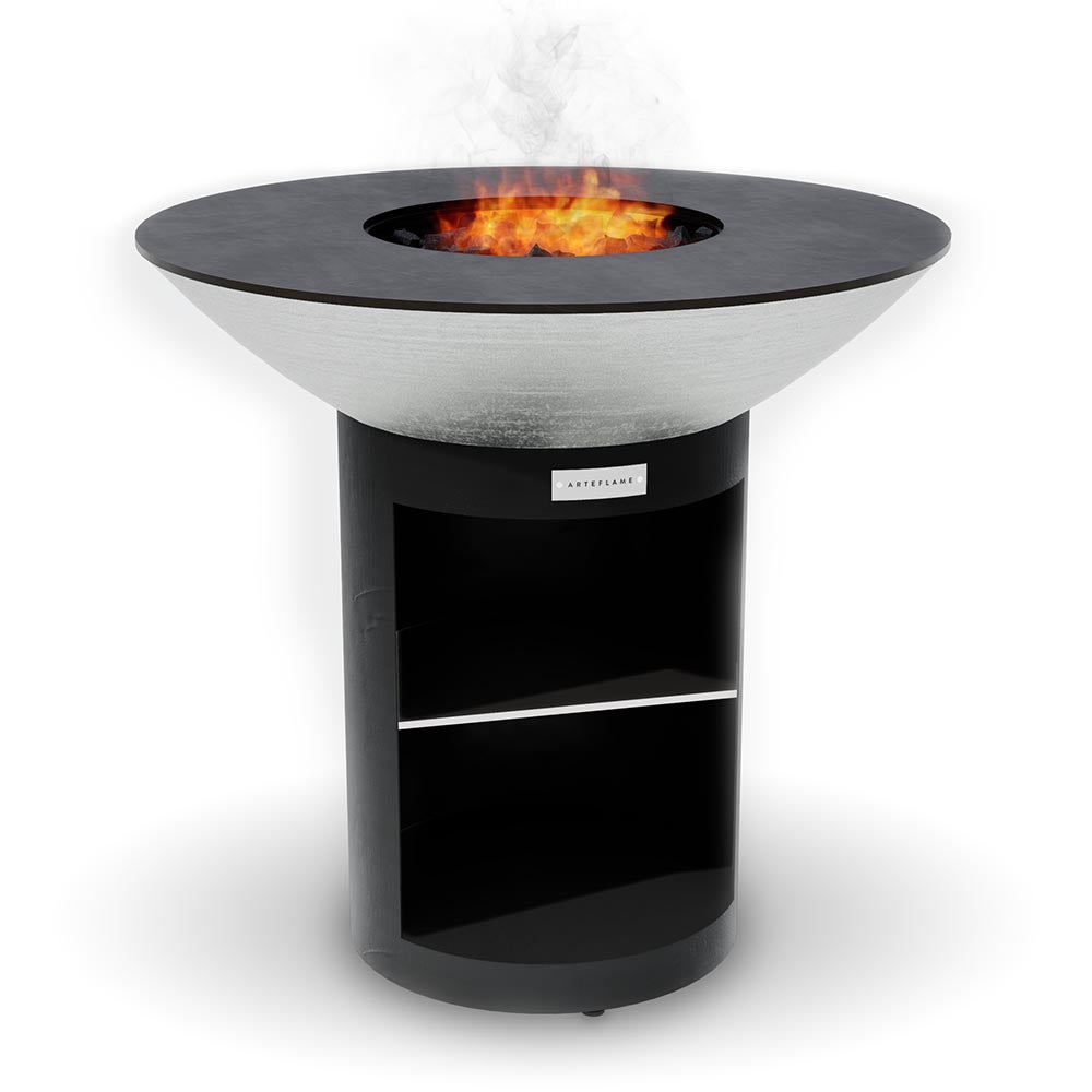 Arteflame 40 stainless grill on the black storage base with a fire in the center