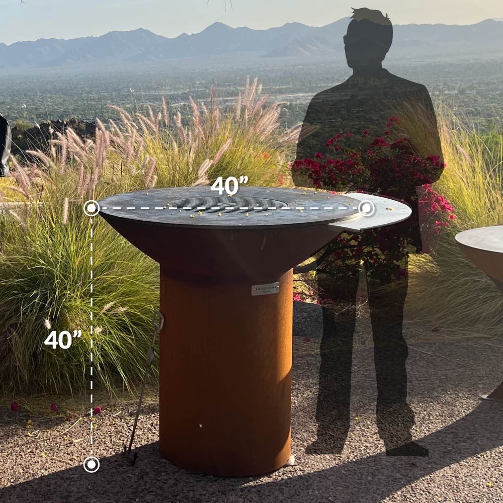 Arteflame Classic 40 next to a person, showing the 40 inch width and 40 inch height
