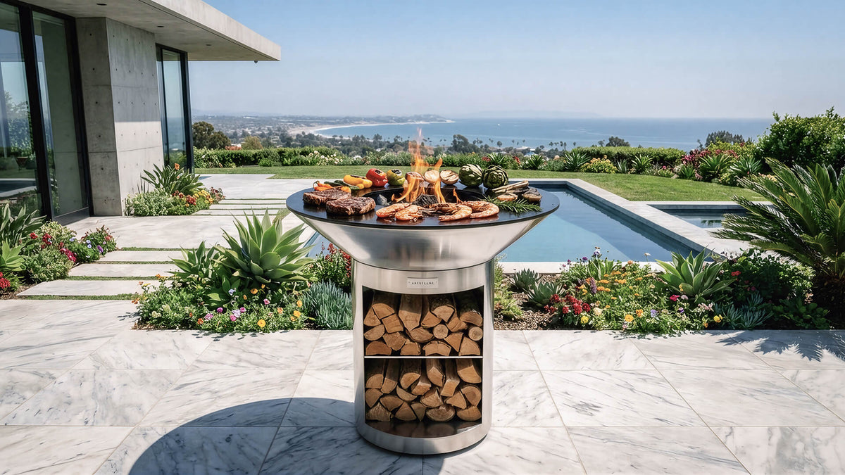 Arteflame 40 stainless grill with storage base on a terrace overlooking the ocean