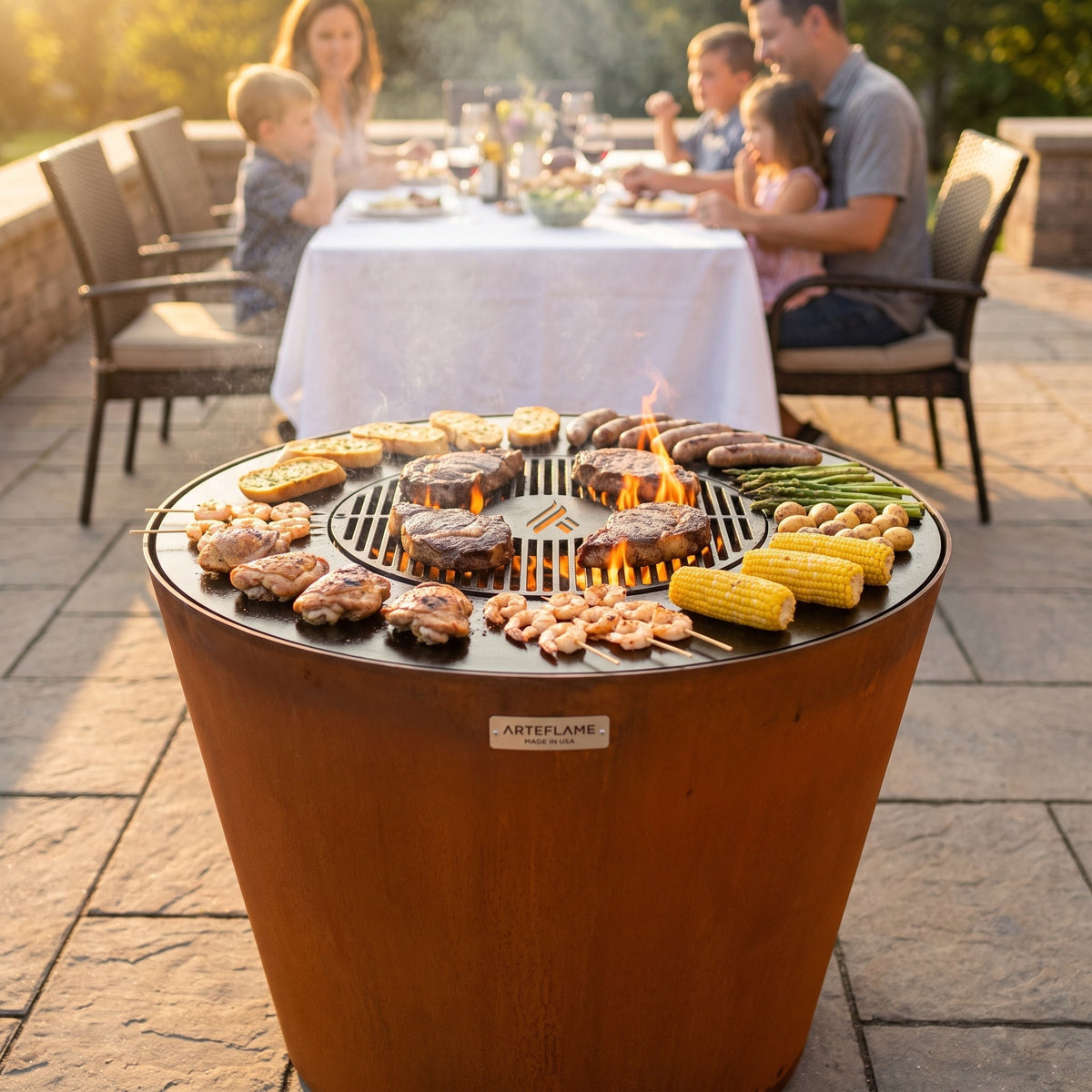 Arteflame ONE30 grill cooking a family meal on a patio